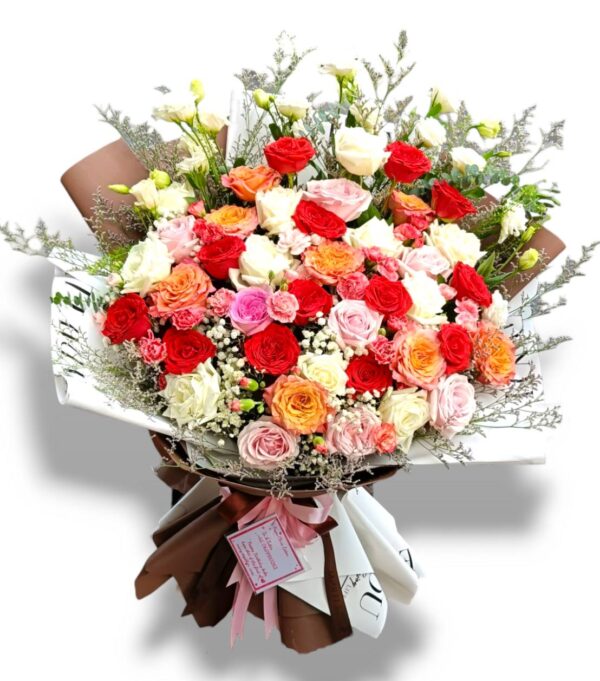 Bouquet of multi-colored roses in warm tones