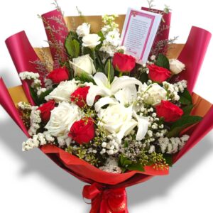 Medium sized bouquet of red and white roses and lilies