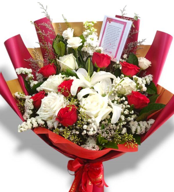 Medium sized bouquet of red and white roses and lilies