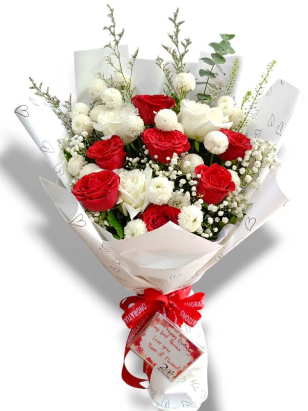 A bouquet of 9 red and white roses