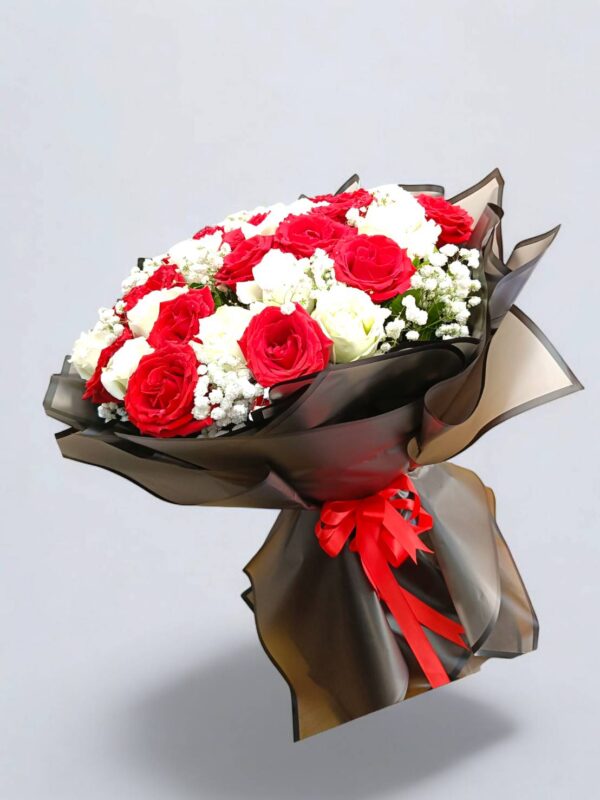 31 red and white roses decorated with black paper