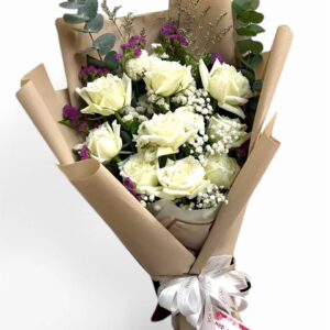 9 long-stemmed white roses decorated with brown paper