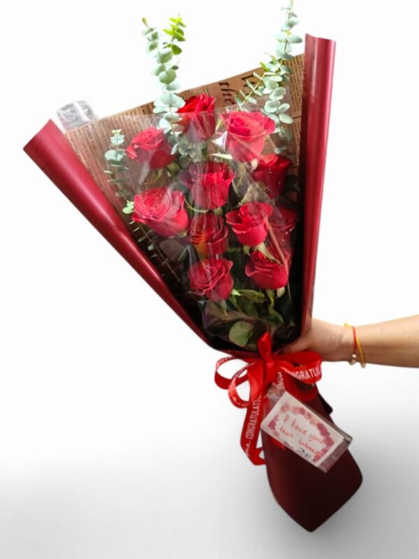 11 long-stemmed red roses, including decorations