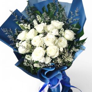 11-12 large white roses decorated with blue or brown paper.