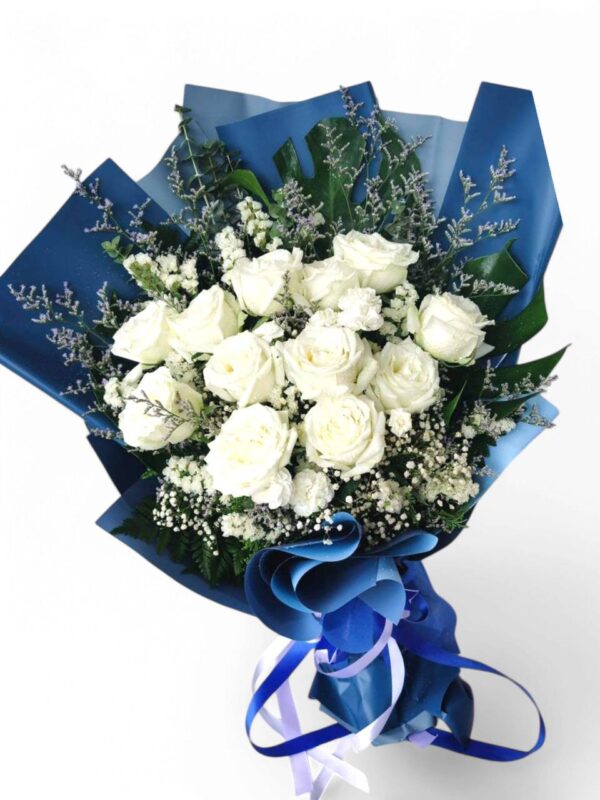 11-12 large white roses decorated with blue or brown paper.