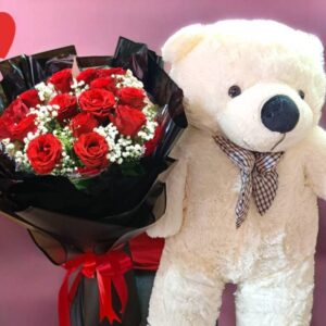 A bouquet of 15 round red roses, black paper flowers and a 70cm long bear.