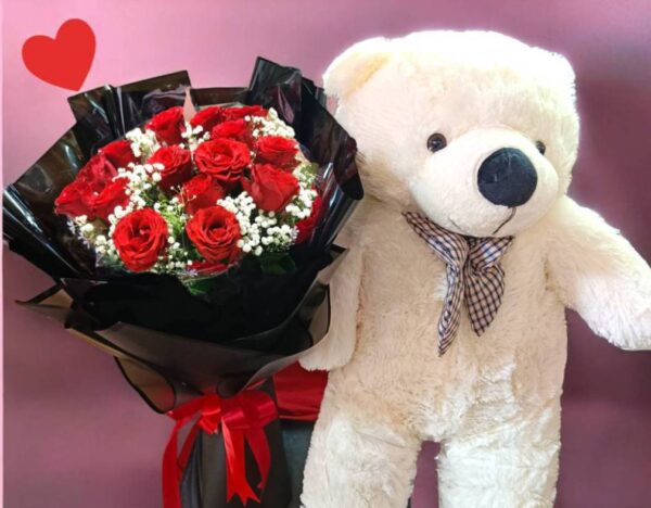 A bouquet of 15 round red roses, black paper flowers and a 70cm long bear.