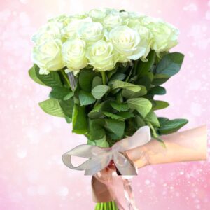 15 long-stemmed white roses decorated with ribbon