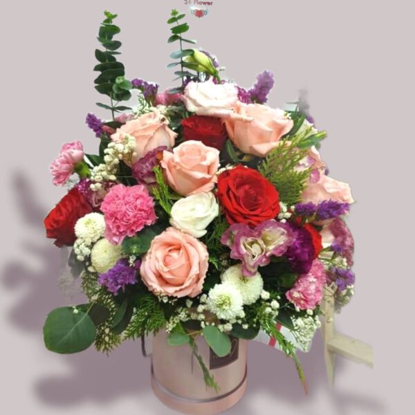 Multi-colored rose box with carnation flowers