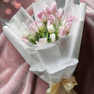 A bouquet of 13 pink tulips