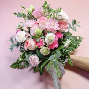 A bouquet of assorted pink flowers